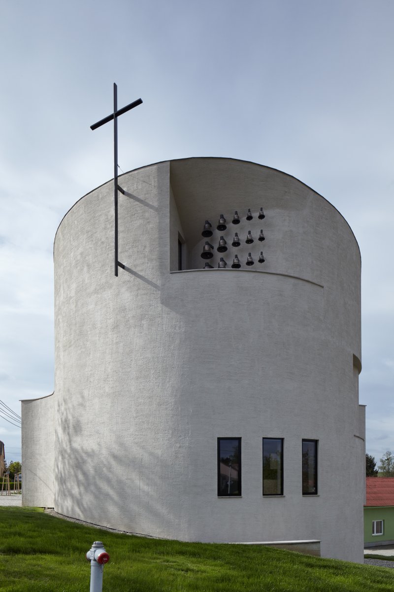 exterior view with cross and bells